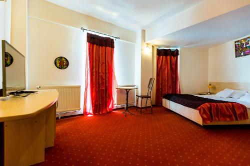 Postel nebo postele na pokoji v ubytování Hotel Onix