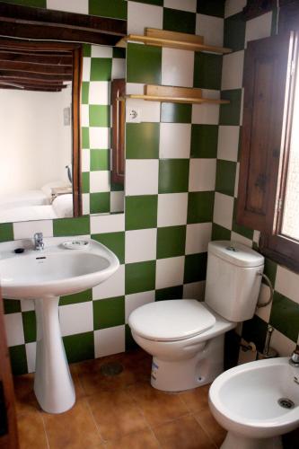 a bathroom with a toilet and a sink at Penthouse duplex in center in Seville