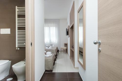 a bathroom with a toilet and a sink at Hotel St. Giorgio in Castel San Giorgio