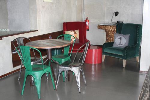 a table and chairs and a table and chairs at N1 Hostel Apartments and Suites in Santarém