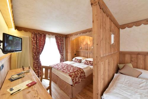 Cama o camas de una habitación en Hotel Miravidi a Cervinia