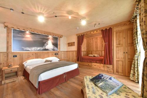 Cama o camas de una habitación en Hotel Miravidi a Cervinia