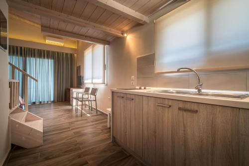 A kitchen or kitchenette at Fiore Beach Studios