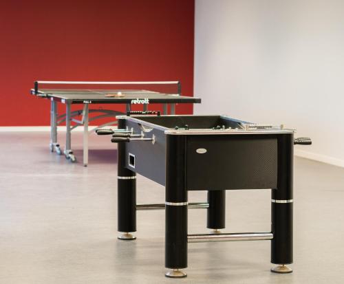 a ping pong table and a ping pong table at 2Home Stockholm South in Stockholm