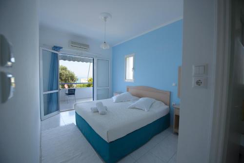 Кровать или кровати в номере Dimitra Apartment Hotel