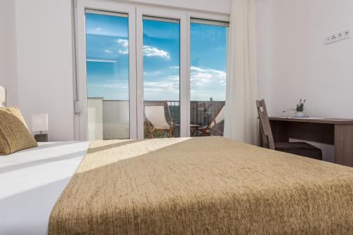 Postel nebo postele na pokoji v ubytování VILE DALMACIJA 365 Sukošan, Zadar county