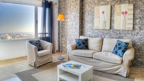 a living room with a couch and a chair at Edificio Prieto VIV 2E in Puerto del Rosario