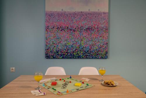 a table with a cake and two glasses of orange juice at Stella in the Village Suites in Plakias