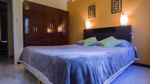 Una cama o camas en una habitación de Estancia Río Abajo