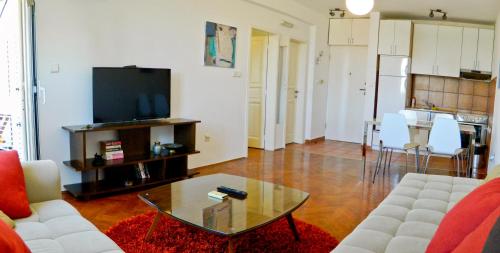 a living room with a couch and a coffee table at Old town Beauty Apartment with great view in Podgorica