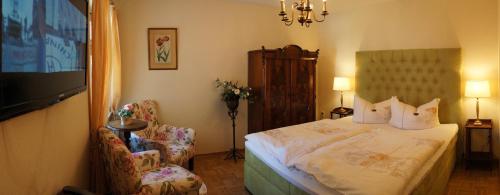 Ein Bett oder Betten in einem Zimmer der Unterkunft Hotel Villa Herzog