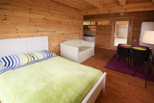 Un pat sau paturi într-o cameră la Villa Medeina