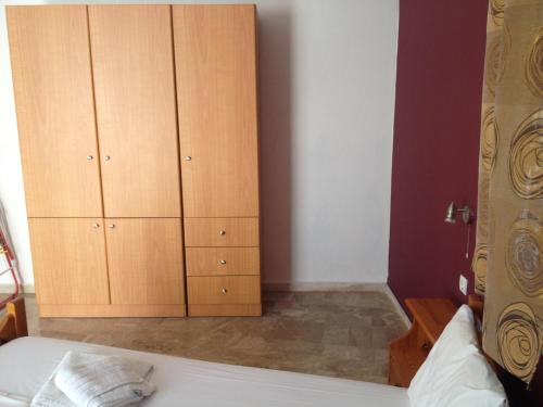 Ένα ή περισσότερα κρεβάτια σε δωμάτιο στο Creta Sun Apartments