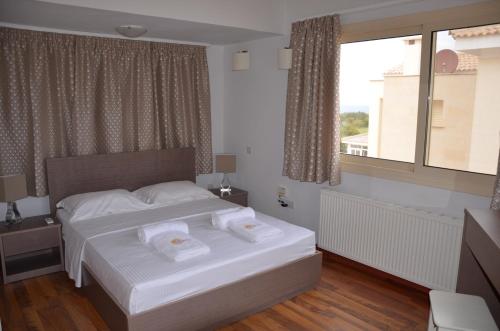 Ein Bett oder Betten in einem Zimmer der Unterkunft Anthorina Villa 6