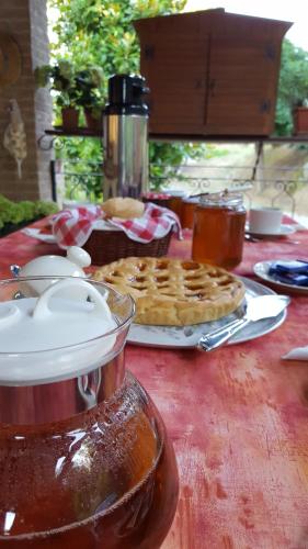 a table with a plate of waffles and a pie at Podere Chiasso Gherardo in Peccioli