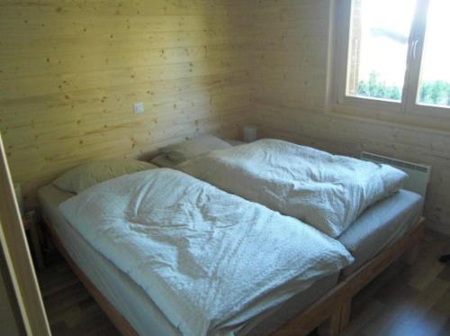 Tempat tidur dalam kamar di Chalet Griffon