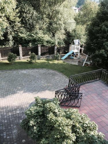 a park with a bench and a playground at Apartamenty Rajcza in Rajcza