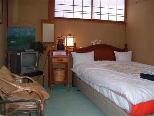 Katil atau katil-katil dalam bilik di Onsen Inn 36So