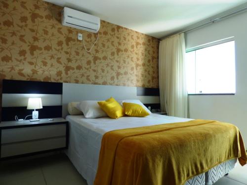 Кровать или кровати в номере Mirante de Escarpas 1501