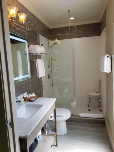 a bathroom with a sink and a toilet and a shower at SenS Hotel & Vanne Bistro Berkeley in Berkeley