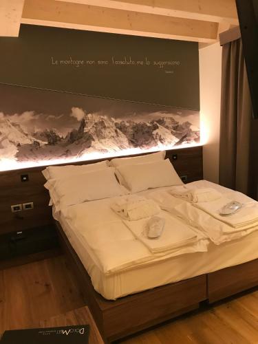 Cama o camas de una habitación en Dolomeet Boutique Hotel