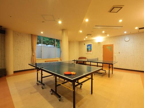 a ping pong room with two ping pong tables at Hotel Sunvalley Nasu in Nasu