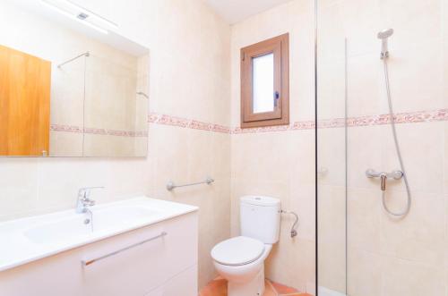 a bathroom with a toilet and a sink and a shower at Sa Caseta De Ses Vaques. Son Covas (Sa Vaqueria 2) in Campos