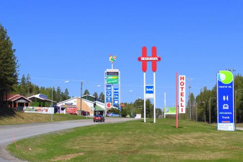 a parking lot filled with lots of different types of signs at Aapiskukko Hotel in Pälkäne