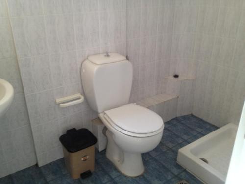 a bathroom with a white toilet and a sink at Villa Marita in Lisvórion
