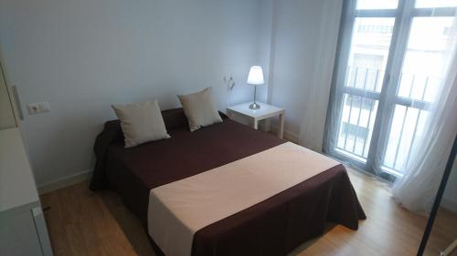 En eller flere senger på et rom på Apartamentos Córdoba Best II