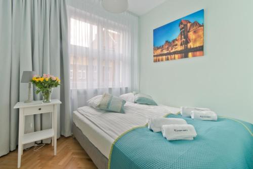 Cama o camas de una habitación en Apartamenty Gdańsk EU - Apartamenty Gdańsk Stare Miasto