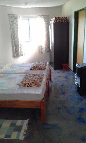 Llit o llits en una habitació de Capricorn Restcamp