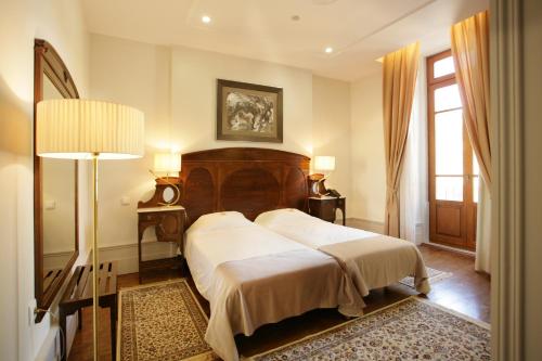 Postel nebo postele na pokoji v ubytování Hotel Ibn-Arrik