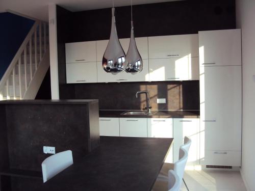 Kuchyň nebo kuchyňský kout v ubytování Rezydencja Rogowo Dune