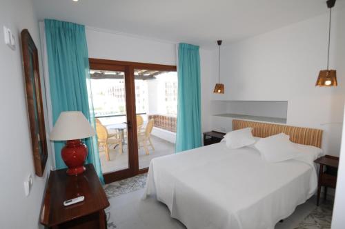 מיטה או מיטות בחדר ב-Chalet Torralba - Villa at Hotel Osiris