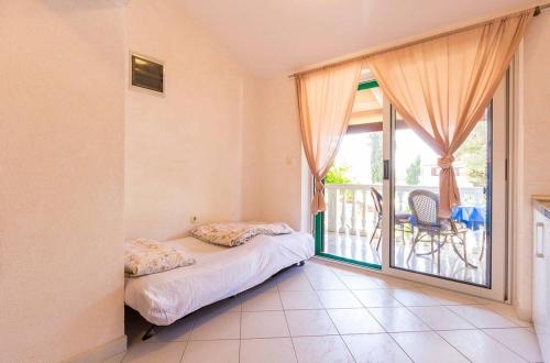 Postel nebo postele na pokoji v ubytování Apartments Vjera