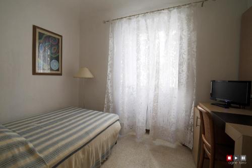 Una cama o camas en una habitación de Albergo Giugni