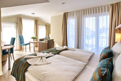Postel nebo postele na pokoji v ubytování AKZENT Apartmenthotel Residenz
