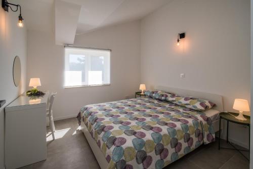 A bed or beds in a room at Franko & Ana apartments