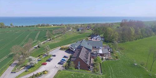an aerial view of a large house in a field at Landhaus Ostseeblick in Kronsgaard