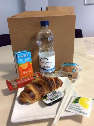 a box with a plate of food and a bottle of water at University of Essex - Southend Campus in Southend-on-Sea