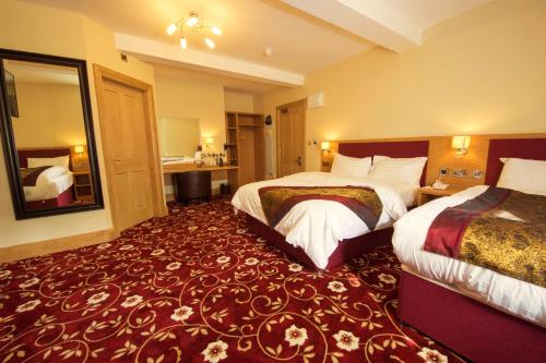 Katil atau katil-katil dalam bilik di Edgerton Hotel