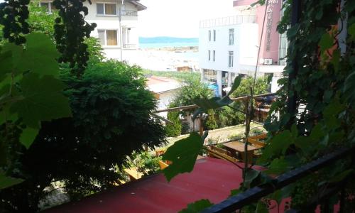 a view of the beach from the balcony of a building at Hotel Bellisimo in Lozenets