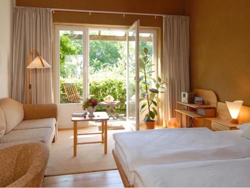 Кровать или кровати в номере Bio- und Gesundheitshotel Gutshaus Stellshagen