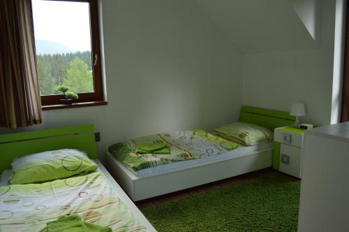 Postel nebo postele na pokoji v ubytování Kamzík Donovaly