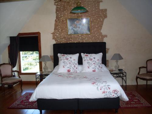 Ліжко або ліжка в номері Chambres d'Hôtes de la Barrerie