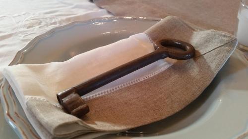 a brown purse sitting on top of a plate at Masseria Luco in Martina Franca