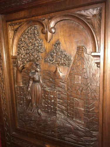 a wooden door with a painting of a woman on it at Résidence La Beauceronne in Ouarville