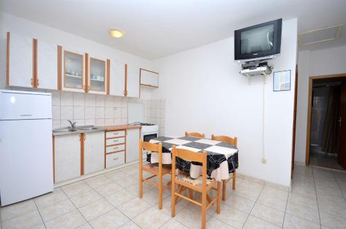 Kuchyň nebo kuchyňský kout v ubytování Apartments Tome