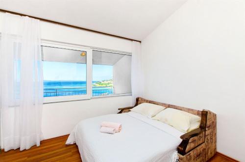 Postel nebo postele na pokoji v ubytování Apartments Tomislav